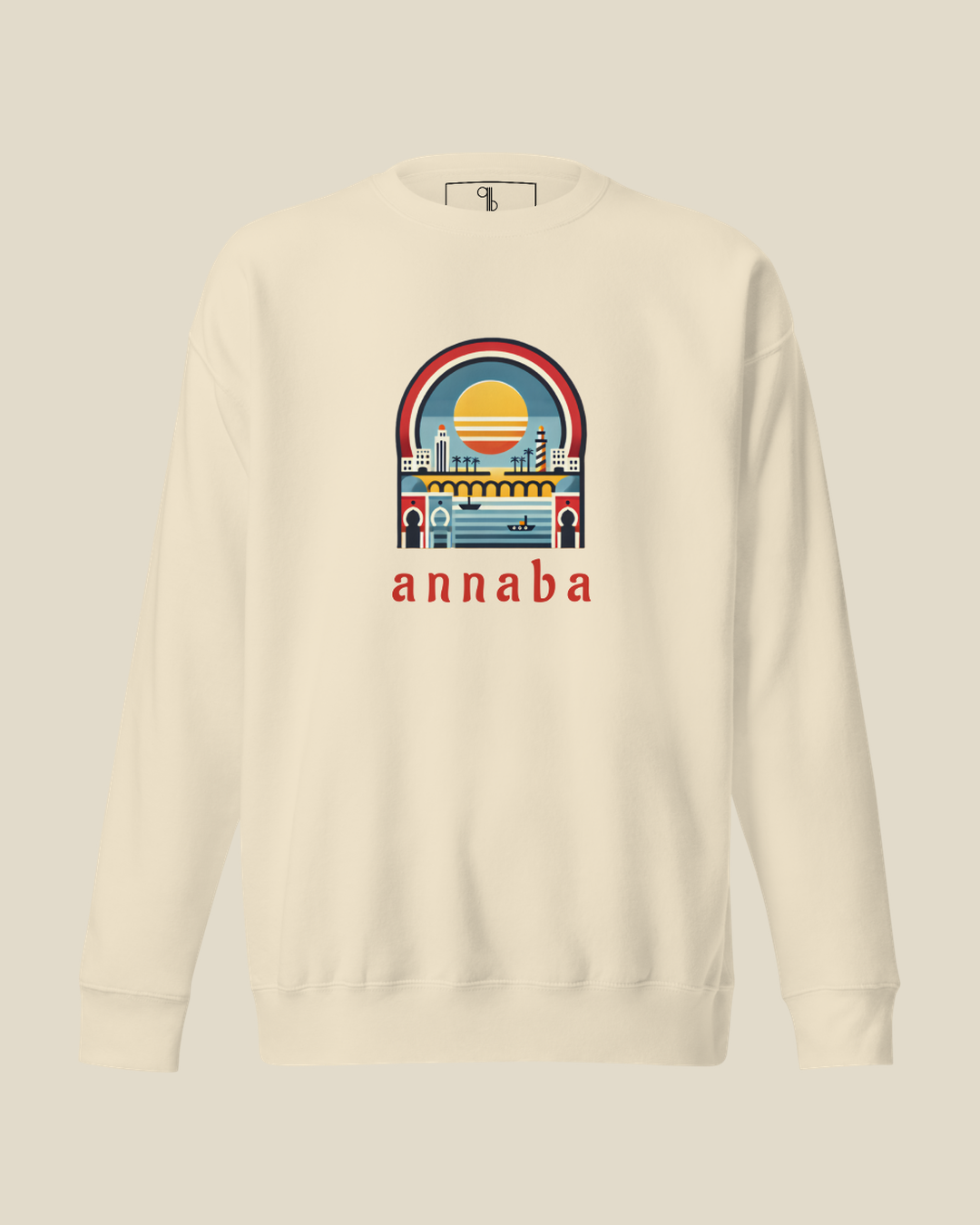 Sweatshirt Annaba Sea crème qalbi vue de face, illustration côtière méditerranéenne et mention annaba imprimées sur la poitrine